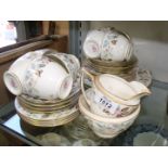 A part Teaset by Minton consisting of eight place settings,