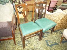 Two similar but not identical Georgian side Chairs having fretworked splats, shaped top rails,