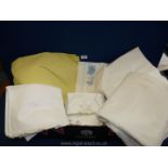 A quantity of sheets and pillow cases, some embroidered.