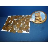 A tin of pre-decimal coins including pennies, halfpennies, threepenny bits, half crowns, etc.