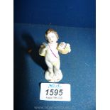 A mid 19th century Naples miniature figure of a putto, mark to base,