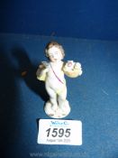 A mid 19th century Naples miniature figure of a putto, mark to base,