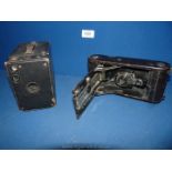 A Kodak camera no. 1A Jr C 1915 and a vintage box Camera.