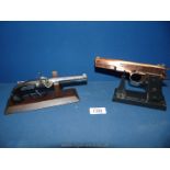 Two novelty pistol cigarette Lighters including Colt 45 automatic calibre, series 90 and another.