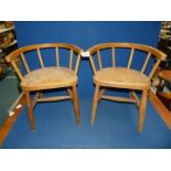Two early 20th century wooden child's chapel chairs.