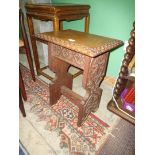 A surprisingly heavy Oak arts and crafts occasional Table having carved edge,