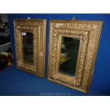 A small pair of ornate plaster gilt Mirrors, 20" long x 14 1/2" wide,