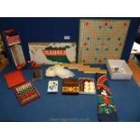 A box of games and novelty items including Scrabble, The Stalk,