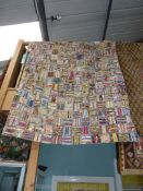 A single patchwork bed cover, some holes,