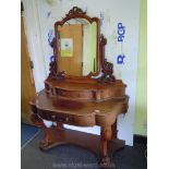 A Victorian Mahogany Duchess type Dressing Table having swing mirror on carved and fretworked