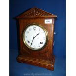 A 1930's Oak mantle Clock, white face, 14" high.
