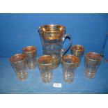 A Lemonade set comprising jug and six glasses,