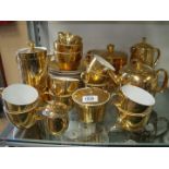 A quantity of Royal Worcester gold lustre tea and coffee ware including tea and coffee pots, cups,
