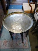 A circular Brass tray top Table,