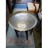 A circular Brass tray top Table,