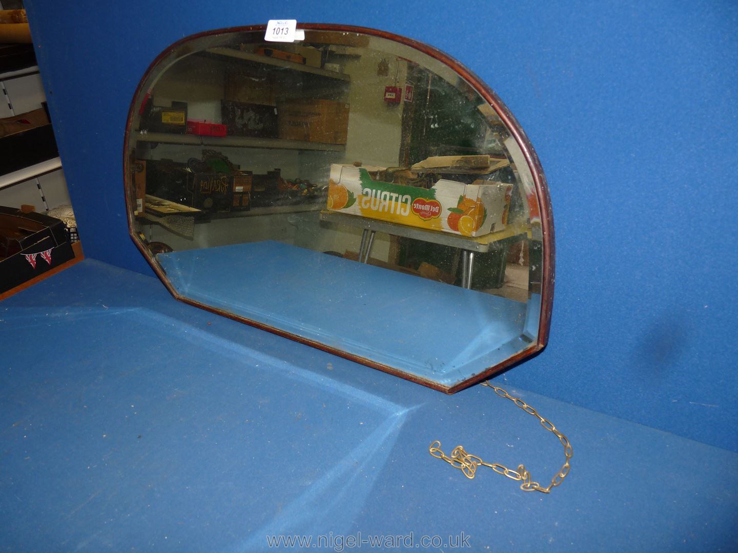 A semi-circular Mirror with bevelled edge in wooden frame.