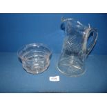 A large 20th Century heavy cut glass jug. 9" tall. Along with a 19th Century cut glass finger bowl.