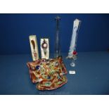 A multi coloured glass dish with butter knife, wine stopper, rose and two long stem vases.