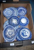 A quantity of blue and white including five 'Old Willow' tea plates, miscellaneous plates, cups,