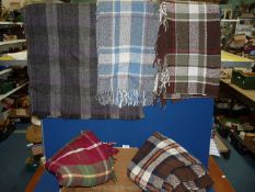 A small quantity of travel rugs in red, brown and blue checks and multi-coloured.