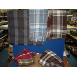 A small quantity of travel rugs in red, brown and blue checks and multi-coloured.