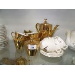 A Midwinter part coffee set and gold coloured coffee set of five cups, coffee pot,