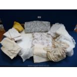 A box containing a selection of tablecloths and miscellaneous crocheted/lace items, serviettes,