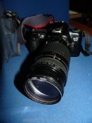 A Canon E05 500 Camera with two lenses, 75-300mm and 35-80 mm, five rolls of film,