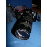 A Canon E05 500 Camera with two lenses, 75-300mm and 35-80 mm, five rolls of film,