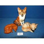 A Beswick Fox lying down,