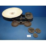 An old set of scales with three weights