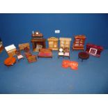 A box of doll's house furniture including wooden wardrobes, table and chairs, etc.
