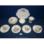 A bone china part Teaset, white ground with floral pattern.