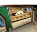 A large gilt framed bevel plated mirror,