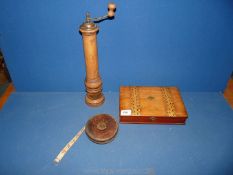 A Tunbridgeware box (a/f) plus leather surveyor's tape measure and pepper mill, dated 1873.