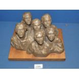 A bronzed effect sculpture of six figures on wooden plinth, marked to rear 2/60 'Audience'.