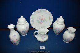 A quantity of Aynsley 'Little Sweetheart' china to include; a pair of lidded vases, a jug, a plate,