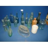 A box of old clear glass bottles including one marked World Famous Blood Mixture and a jelly mould.