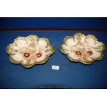 Two old scalloped edged Bowls with floral decoration highlighted by hand,