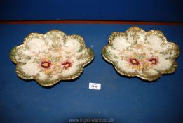 Two old scalloped edged Bowls with floral decoration highlighted by hand,