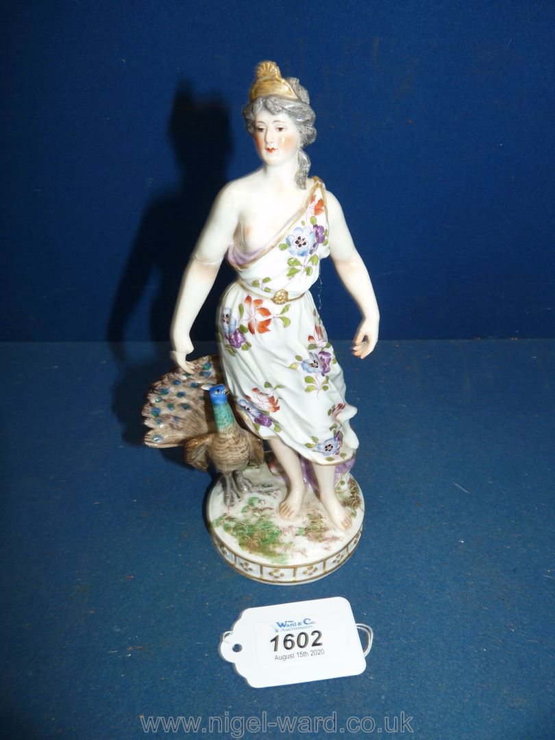 A 19th century Royal Vienna figure of a Juno accompanied by her peacock; shield mark in blue,