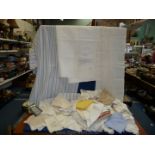 A quantity of linen including lace edged napkins and tablecloths, crocheted mats, bed sheets,