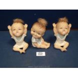 Three Pwllheli made china dolls, similar to Piano babies, with real hair pieces.