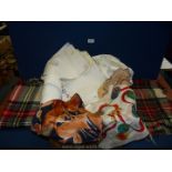 A quantity of linen including tablecloths, napkins, two tartan travel rugs, scarves, etc.