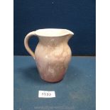 An Ewenny Jug in pink mottled finish, 5 1/4'' tall.