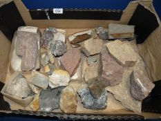 A quantity of stone samples, some with labels.