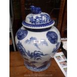 A Chinese lion pot and a very large blue and white ginger jar with lid, 21" tall.