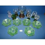 A quantity of glass including a small pale pink stripe swirl vase, six green fruit dishes,