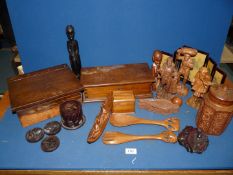 A box of wooden items including carved figures, Indian carved jar, miniature oriental screen etc.