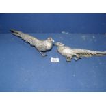 A pair of white metal peacocks, 12" long.